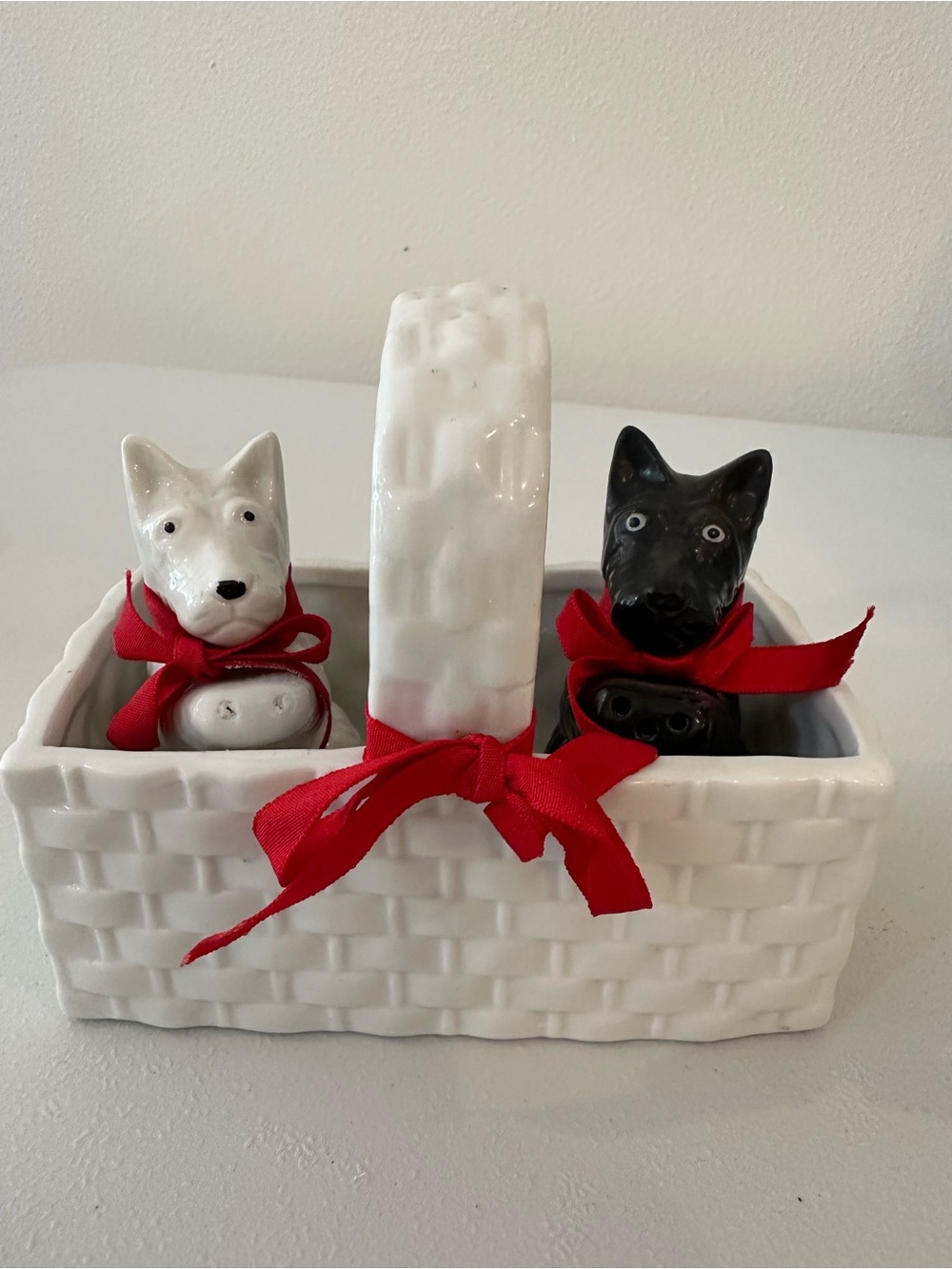 Vintage Scottie Dog ceramic salt and pepper shaker with basket.